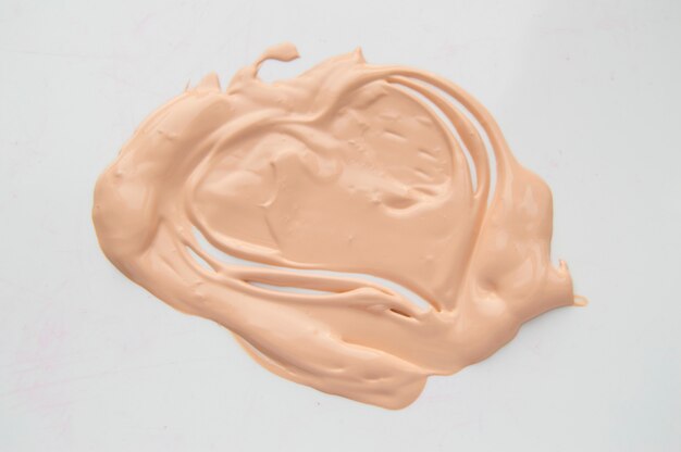 Painted heart, a smear of liquid type Foundation, concealer, white background