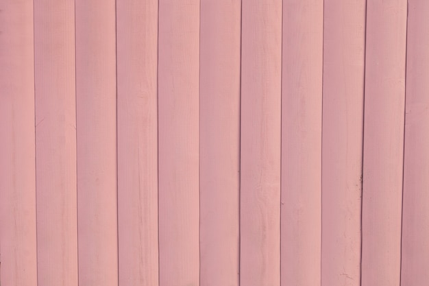 Fondo di legno rustico rosa chiaro dipinto del bordo. spazio per il testo: terreno in legno di tavolato dipinto. foto colorata orizzontale.