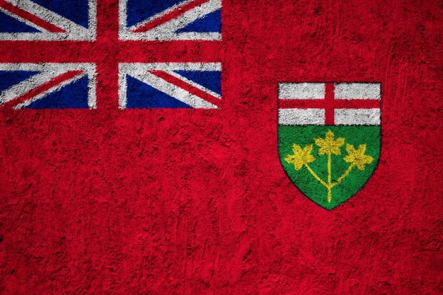 Photo painted national flag of ontario on a concrete wall