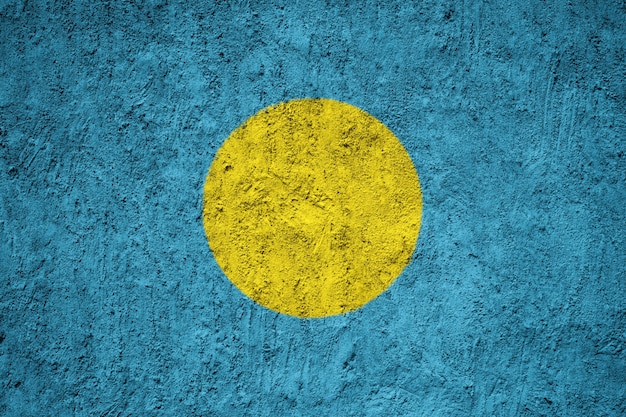 Painted national flag of Palau on a concrete wall