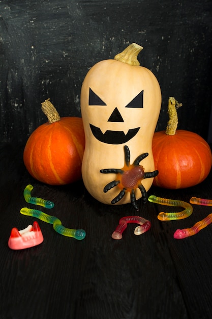 Photo painted pumpkin for halloween on the dark background