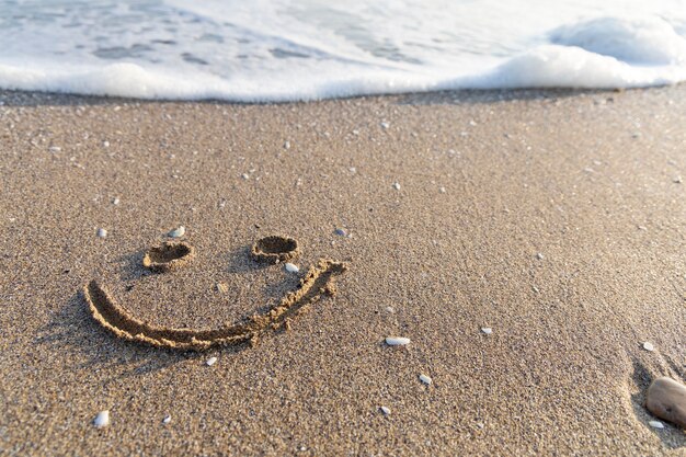 A painted smile in the sand.