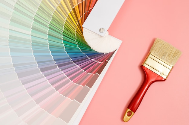 A painter is choosing a paint shade for the interior of the house's walls. with interior