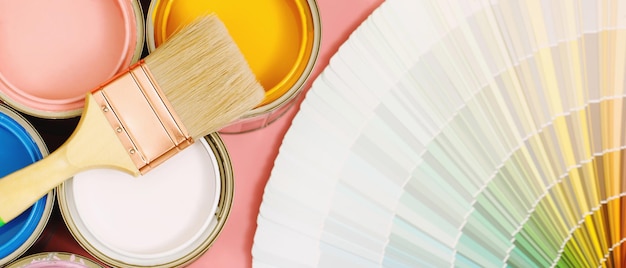 A painter is choosing a paint shade for the interior of the house's walls with interior