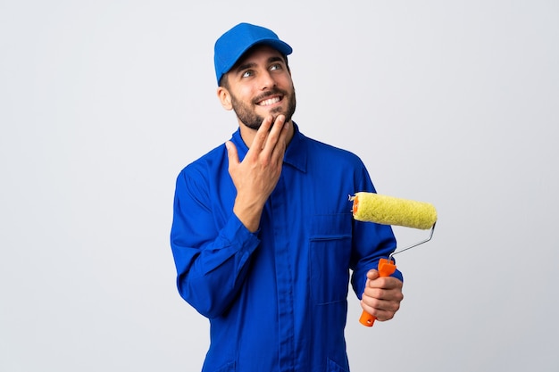 Painter man holding a paint roller