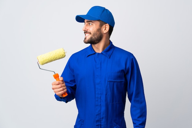 Painter man holding a paint roller