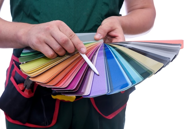 Painter's hands with colour swatch close up