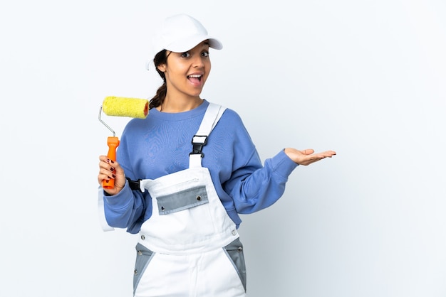 Painter woman over isolated white with shocked facial expression