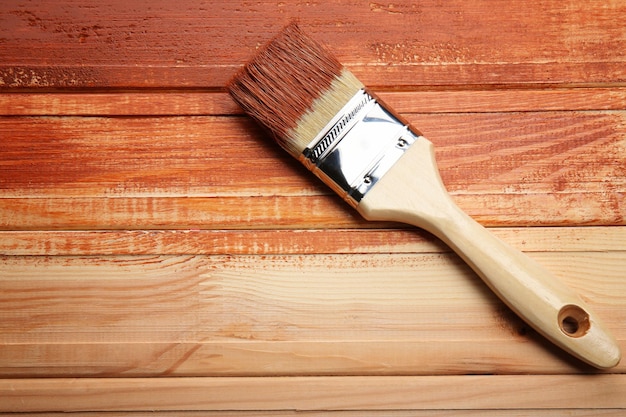 Painting brush on wooden background