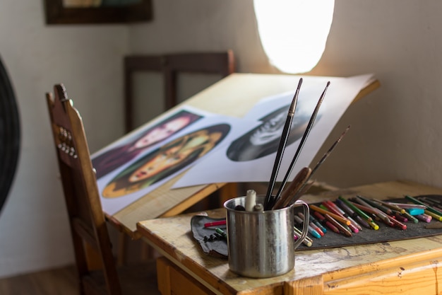 painting and drawing utensils in a studio