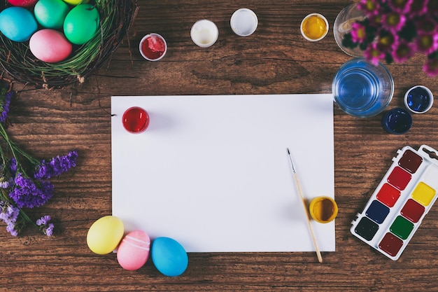 Painting eggs for easter holiday celebration toned picture top view selective focus copyspace