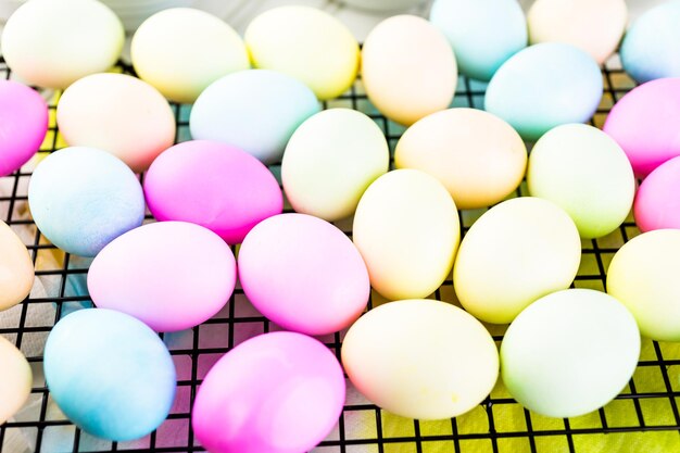 Painting eggs in pastel colors for Easter.