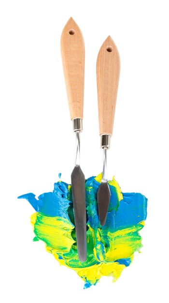 Painting palette knifes with paint isolated on white