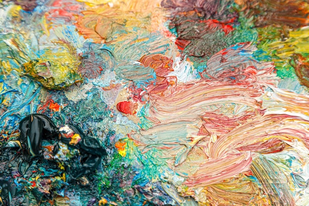 painting palette with different colors of paint closeup