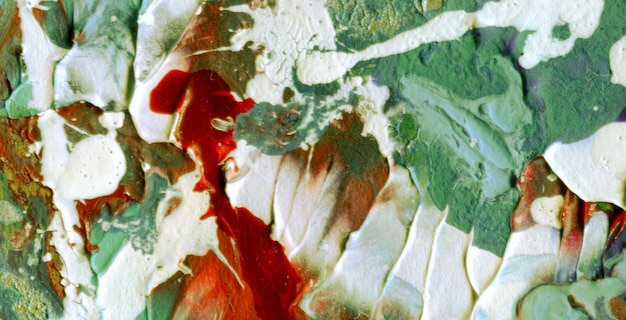 A painting of a red and green leaf