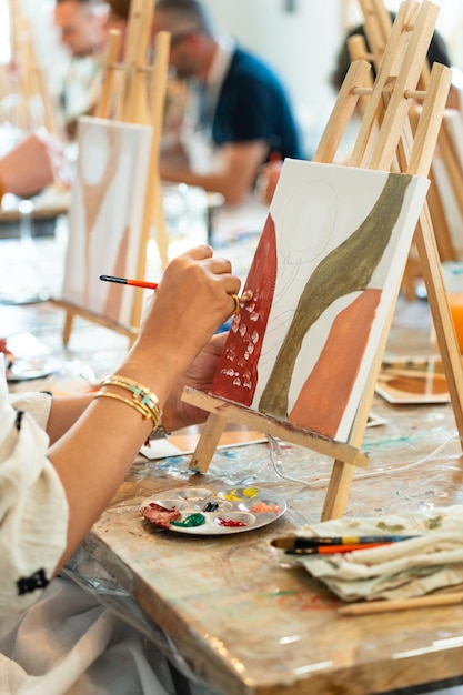 Painting and sip workshop Woman enjoying art and wine