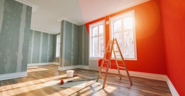 Painting wall red in room before and after restoration or\
refurbishment