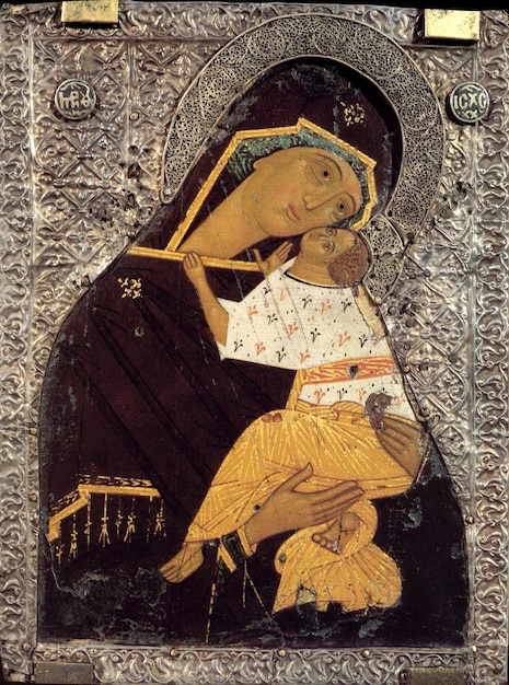 Photo a painting of a woman holding a baby and a cross with a cross on it