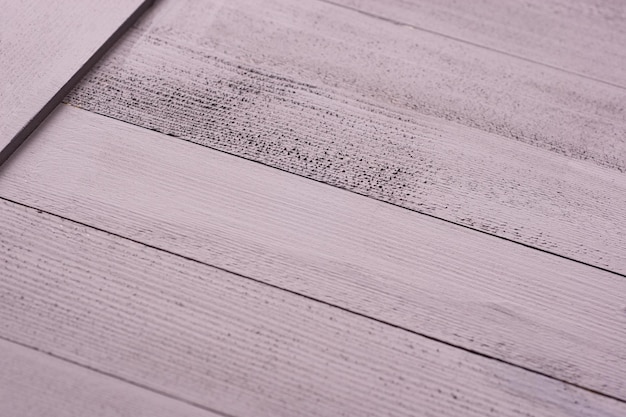 Painting a wooden surface with a brush and grayxA paint Natural wooden texture Renovation or repair construction