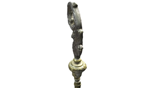 A pair of antique bronze cast iron candle holders