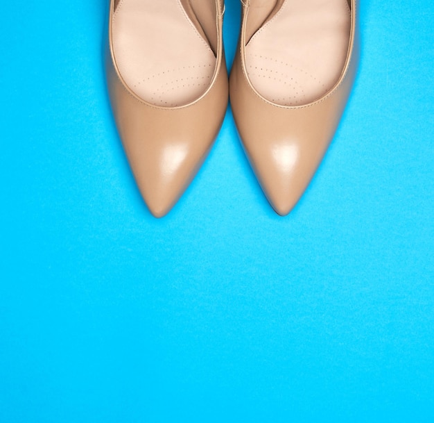 pair of beige womens shoes with a sharp toe