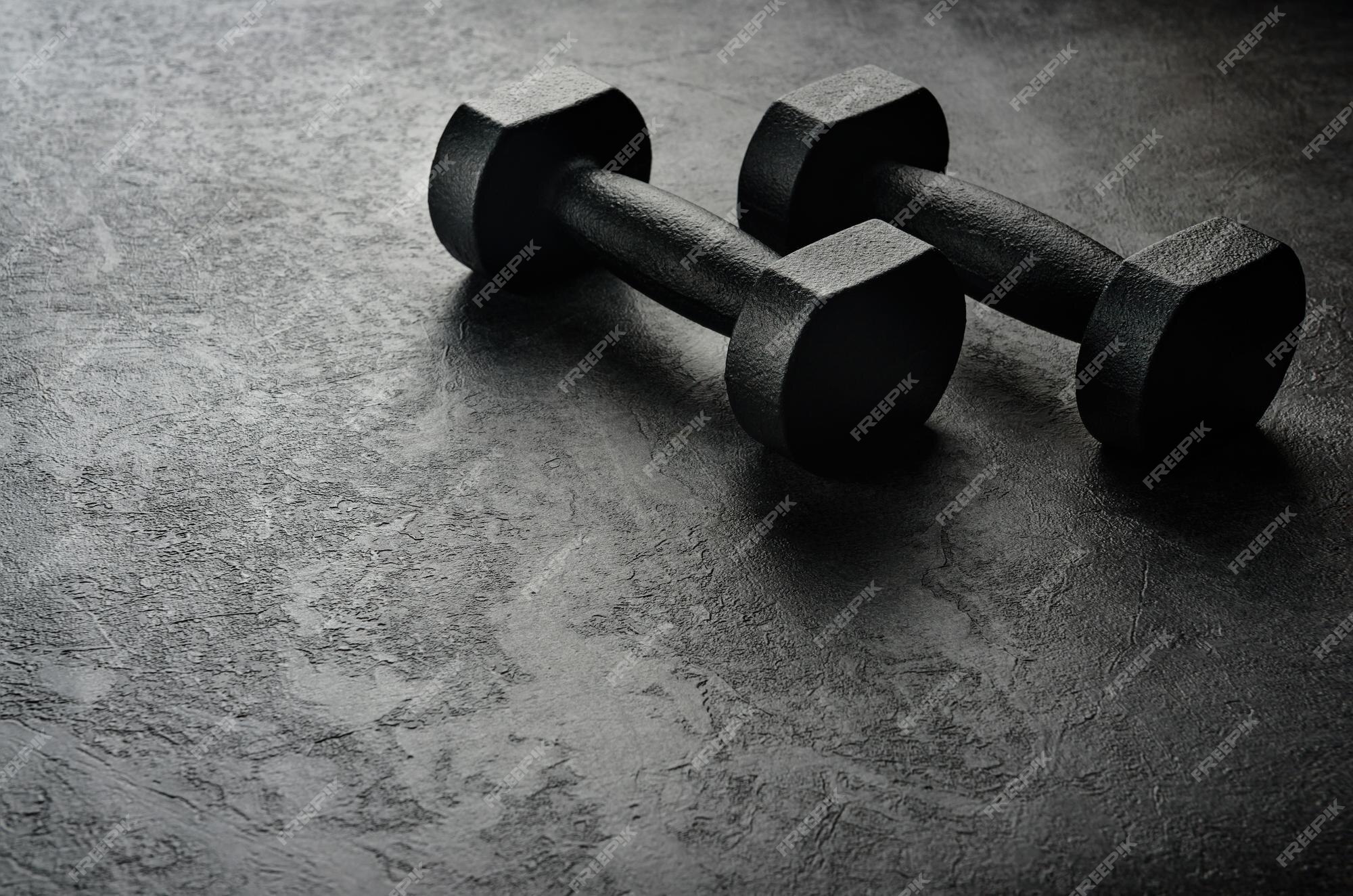 Premium Photo  Dumbbell on a black background