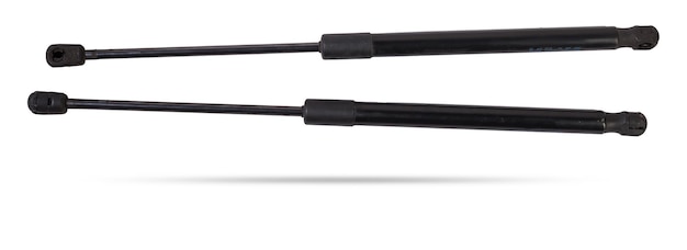 A pair of black metal hood shock absorbers with chrome elements detail of a car mechanism on a white isolated background Spare parts for body repair