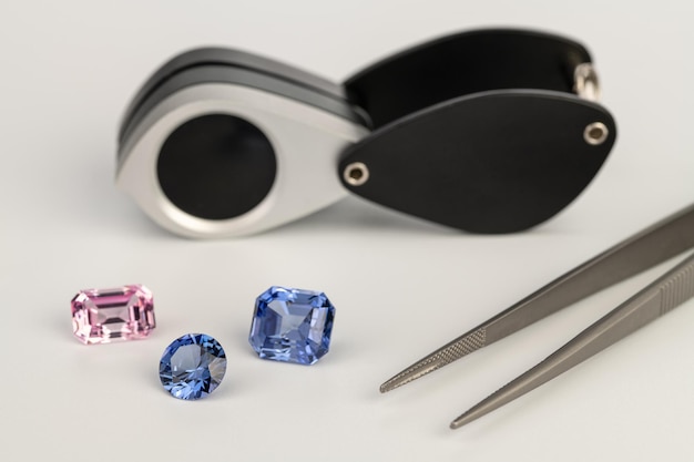 A pair of blue sapphires are on a table.