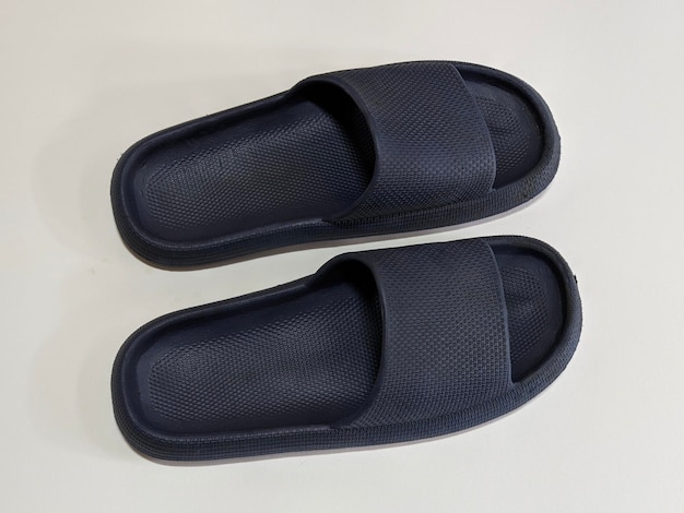 A pair of blue slippers on isolated background