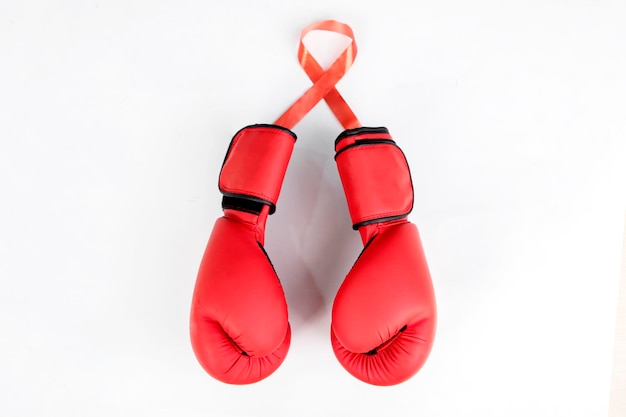 Pair of boxing gloves attached to the red ribbon