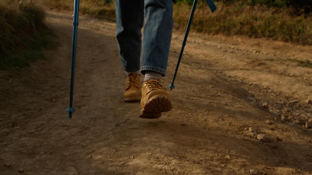 A pair of brown shoes with yellow laces