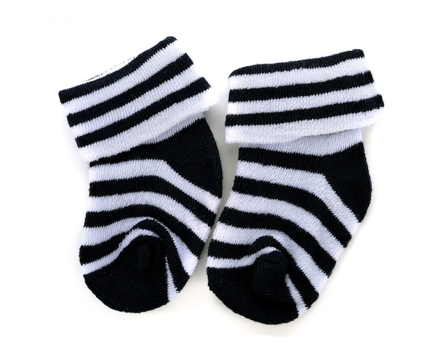 Pair of child's striped socks on a white