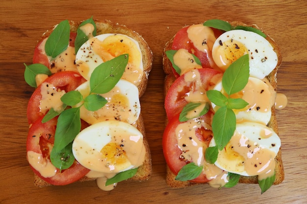 Pair of Delectable Hard Boiled Egg with Tomato Basil Open Faced Sandwiches