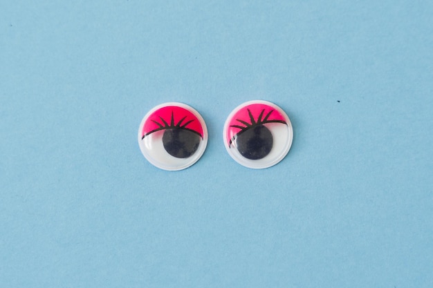 A pair of eyeballs on a blue background