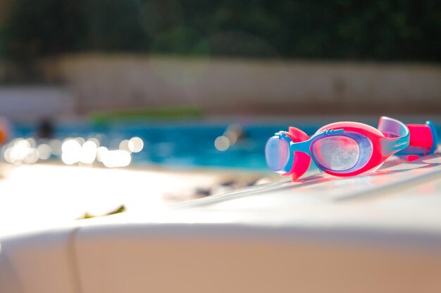 A pair of goggles that are on a ledge