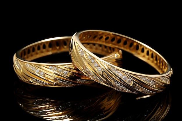 A pair of gold and diamond bangles with diamonds