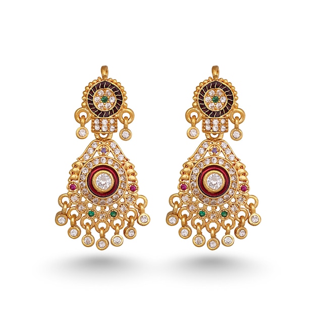 Photo a pair of gold earrings with a green stone and red stones.