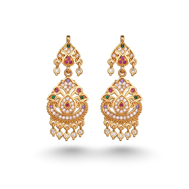 A pair of gold earrings with green stones and rubies