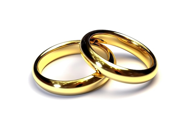 A pair of gold rings are laying on a white background.