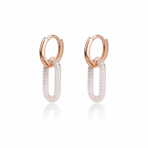 A pair of hoop earrings with diamonds on the side.