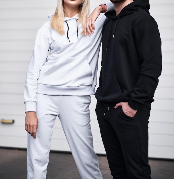 Photo pair of man and woman is wearing hooded sweatshirt copy space hoodie design for branding clothes