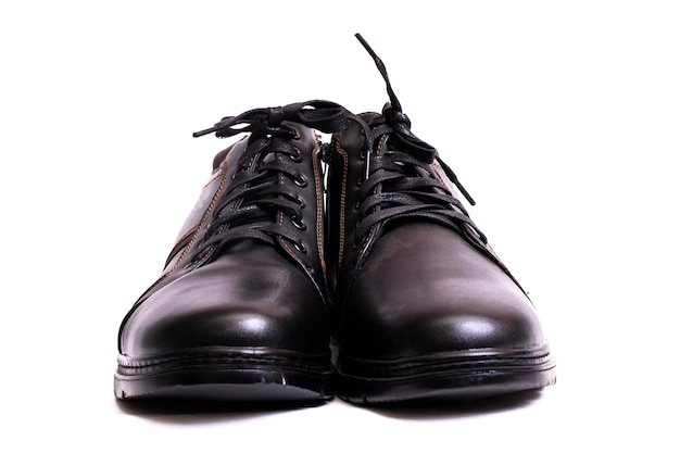 Pair of mens black boots isolated on white background