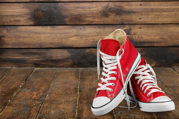 Pair of new red sneakers isolated on background.