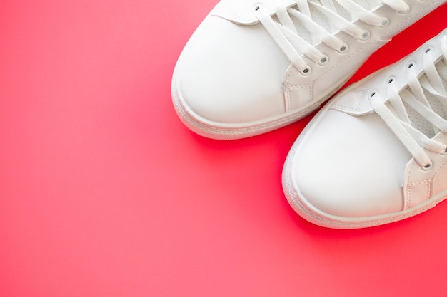 Pair of new stylish white sneakers