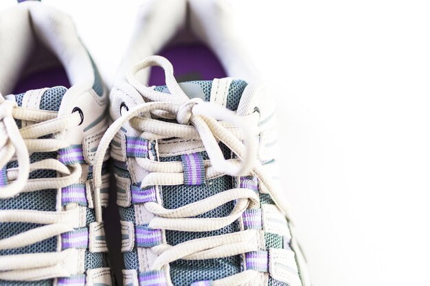 Pair of new womens hiking shoes on a white background.