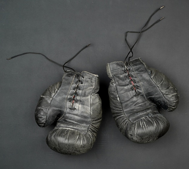 Pair of old black leather boxing gloves