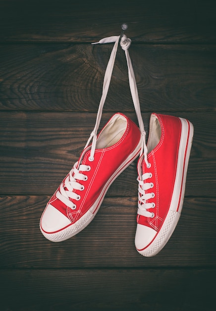 A pair of old red sneakers 