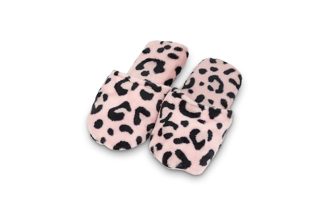 A pair of pink leopard slippers with a black print on the front.