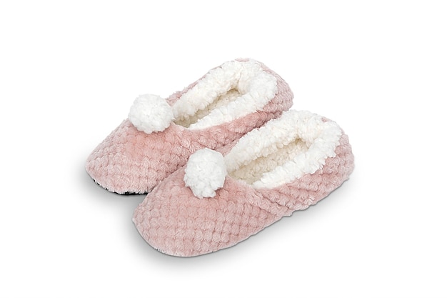 A pair of pink slippers with fluffy fluffy pom poms.