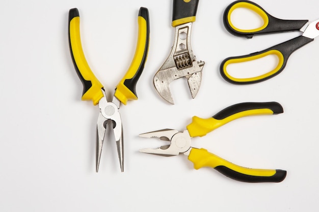 A pair of pliers, one of which is yellow and black.